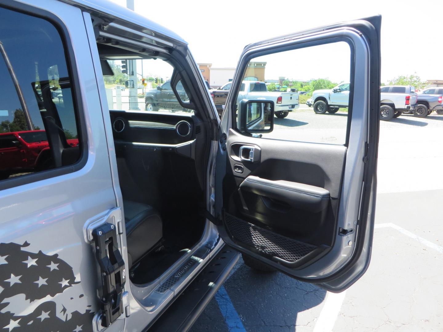 2021 SILVER /BLACK Jeep Wrangler Unlimited Rubicon 4XE 4d SUV 4wd (1C4JJXR63MW) with an 2.0L L4 DOHC 16V TURBO engine, automatic transmission, located at 2630 Grass Valley Highway, Auburn, CA, 95603, (530) 508-5100, 38.937893, -121.095482 - Impressive 4xe Rubicon with a ton of extras that include Fox 3.0 internal bypass front and rear shocks, 315 BFG KO2 tires, Warn winch, Factor 55 Ultra hook, Front bumper stinger, Rigid Pods on front bumper, Rigid A series lights in the roof rack, DV8 lockable hood pins, Westin Running boards, Fury d - Photo#53